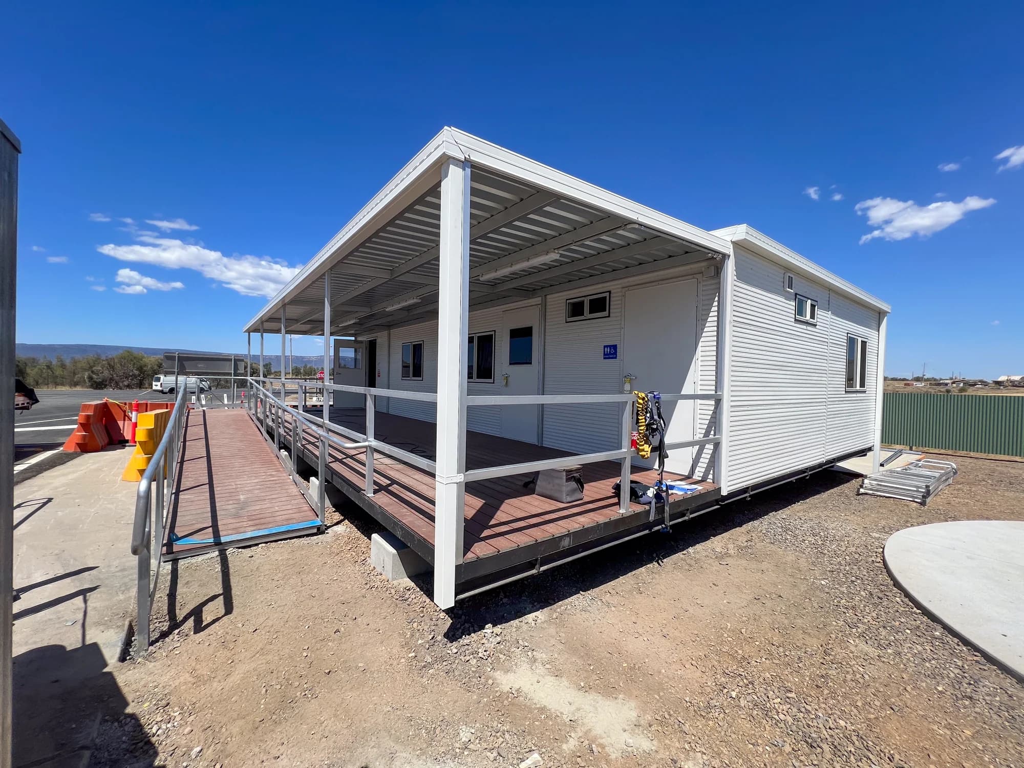 Keeping Place building with a long access ramp, handrails and covered deck